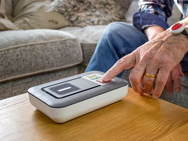 Man pressing his Lifeline alarm